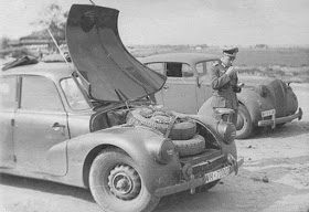 Nazi high ranking officer prepares the "frunk" to commit suicide in his Tatra T87, an inspiration to Tesla management.